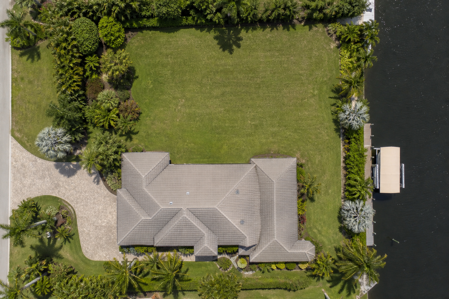 Top-down aerial view of a Southwest Florida property with an open backyard